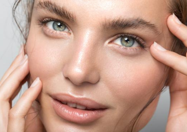 Woman with clean smooths skin after microneedling treatment