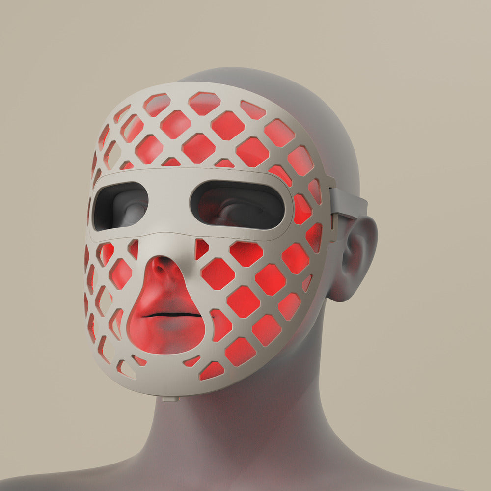Featuring a red silicone LED light therapy mask, representing the Peachaboo Glo Aurora's advanced technology.