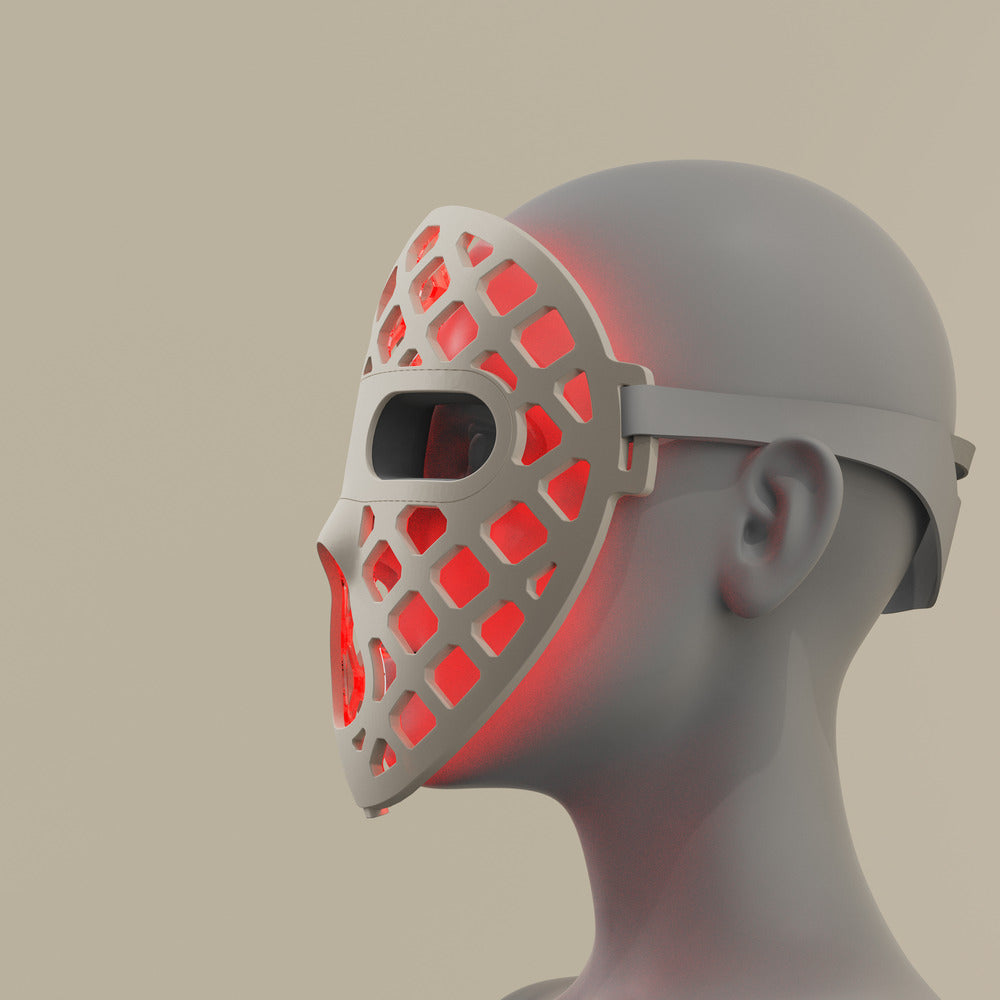 Featuring a red silicone LED light therapy mask, representing the Peachaboo Glo Aurora's advanced technology.