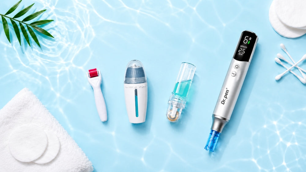 Flat lay of microneedling skincare tools, including a Dr. Pen microneedling pen, derma roller, derma stamp, arranged with cotton pads, cotton swabs and green leaves on a clean white and light blue background.