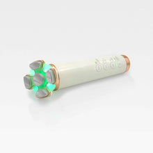 Load image into Gallery viewer, A sleek white and gold skincare device featuring a glowing green LED light, designed for skin tightening and contouring.