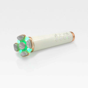 A sleek white and gold skincare device featuring a glowing green LED light, designed for skin tightening and contouring.