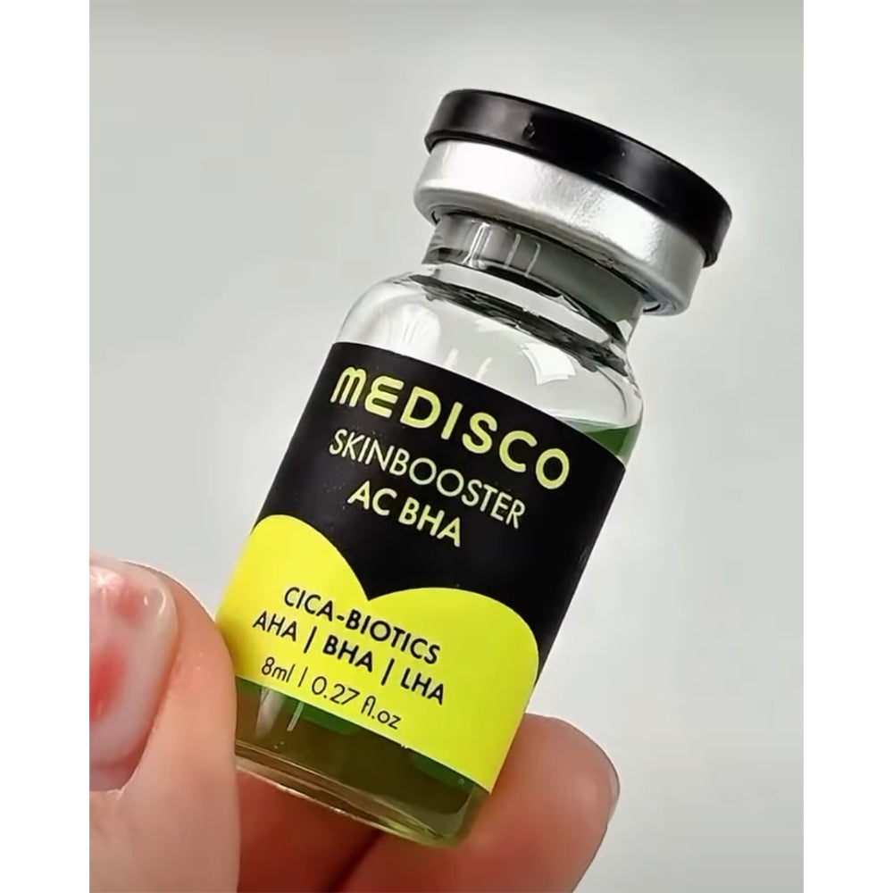 Close up to Medisco Skinbooster AC BHA vial held in a hand 