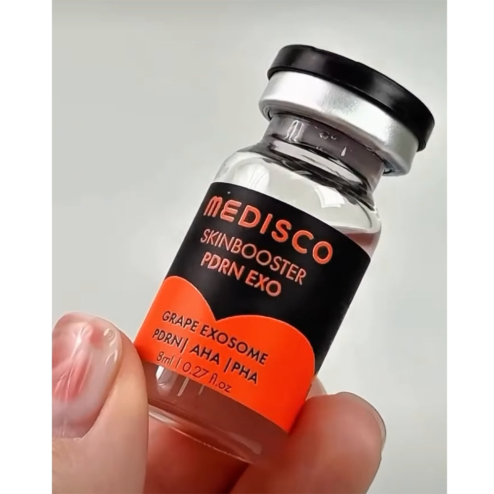 Hand holding a Medisco SkinBooster PDRN EXO 8ml vial against a gray background