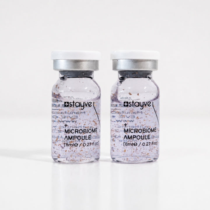 Two Stayve Microbiome Ampoule vials with purple formula for cosmetic skin treatments