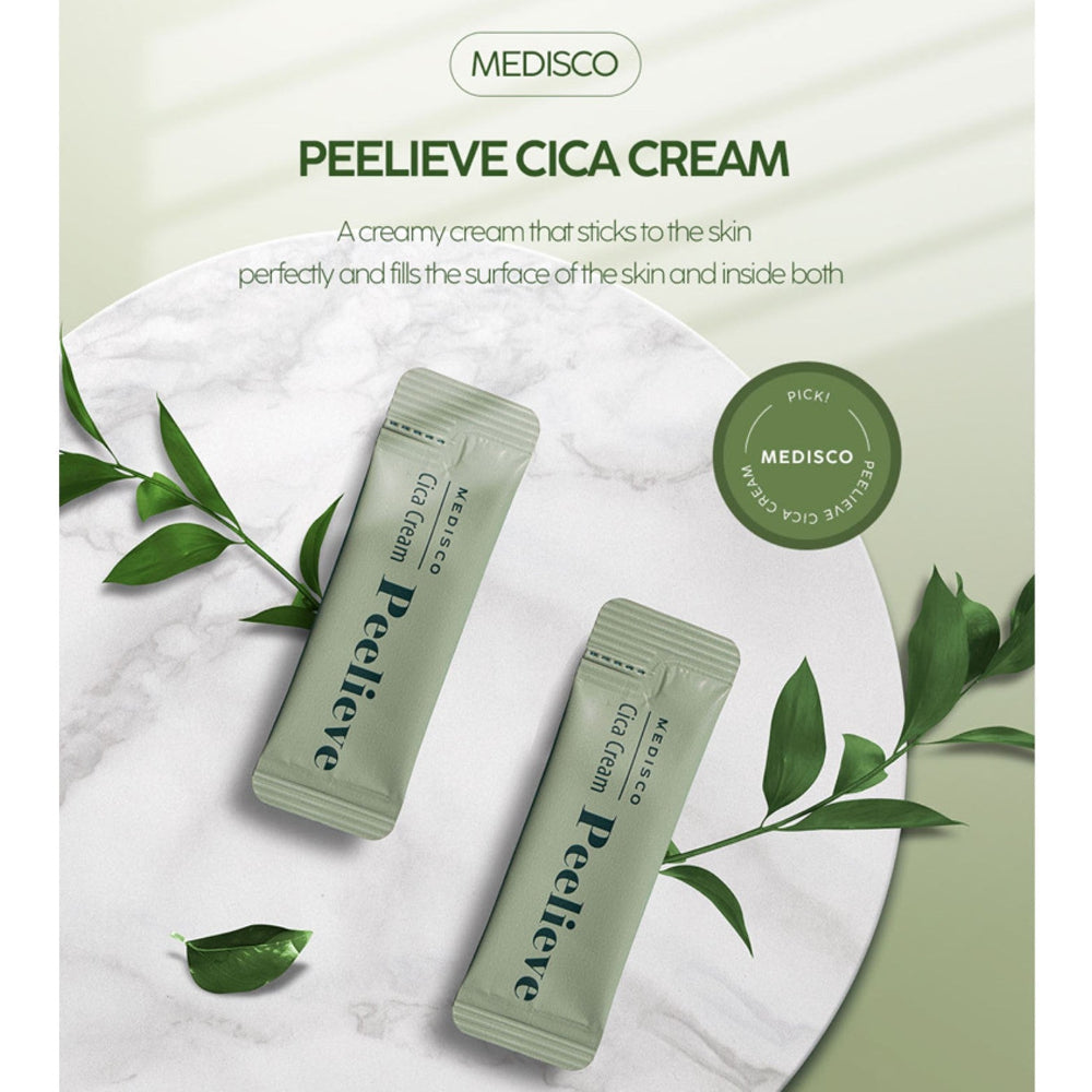 Two Medisco Peelieve Cica Cream pouches displayed on a marble surface with green leaves and product branding in the background.
