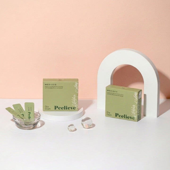 Medisco Peelieve Cica Cream boxes and pouches for professional post-treatment skincare against a peach background