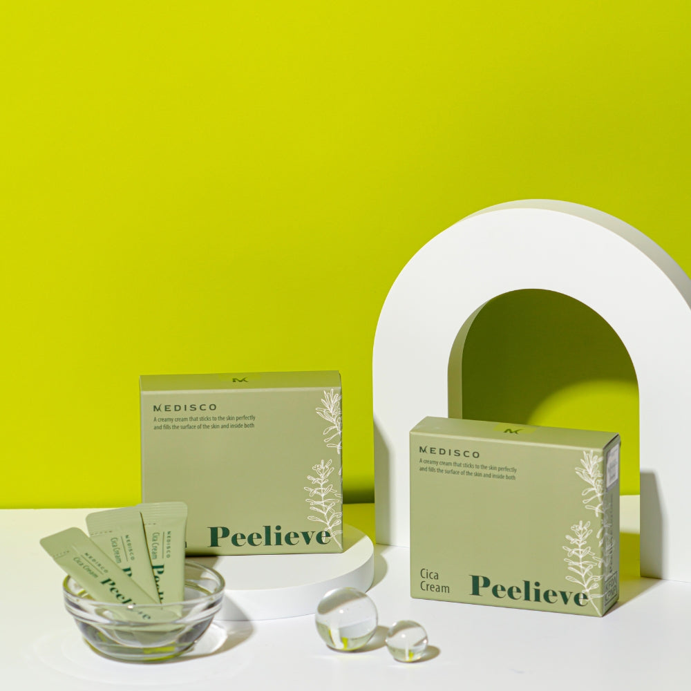 Medisco Peelieve Cica Cream boxes and pouches on a white surface with a green